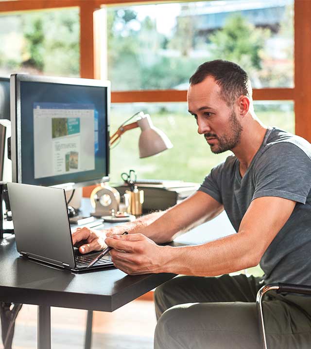Man sat down on a computer