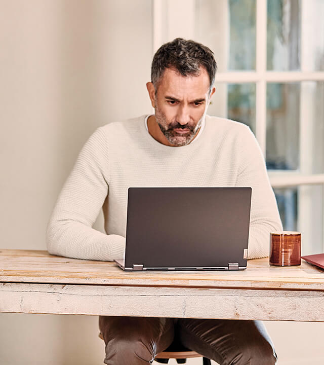 Man sat down on a computer